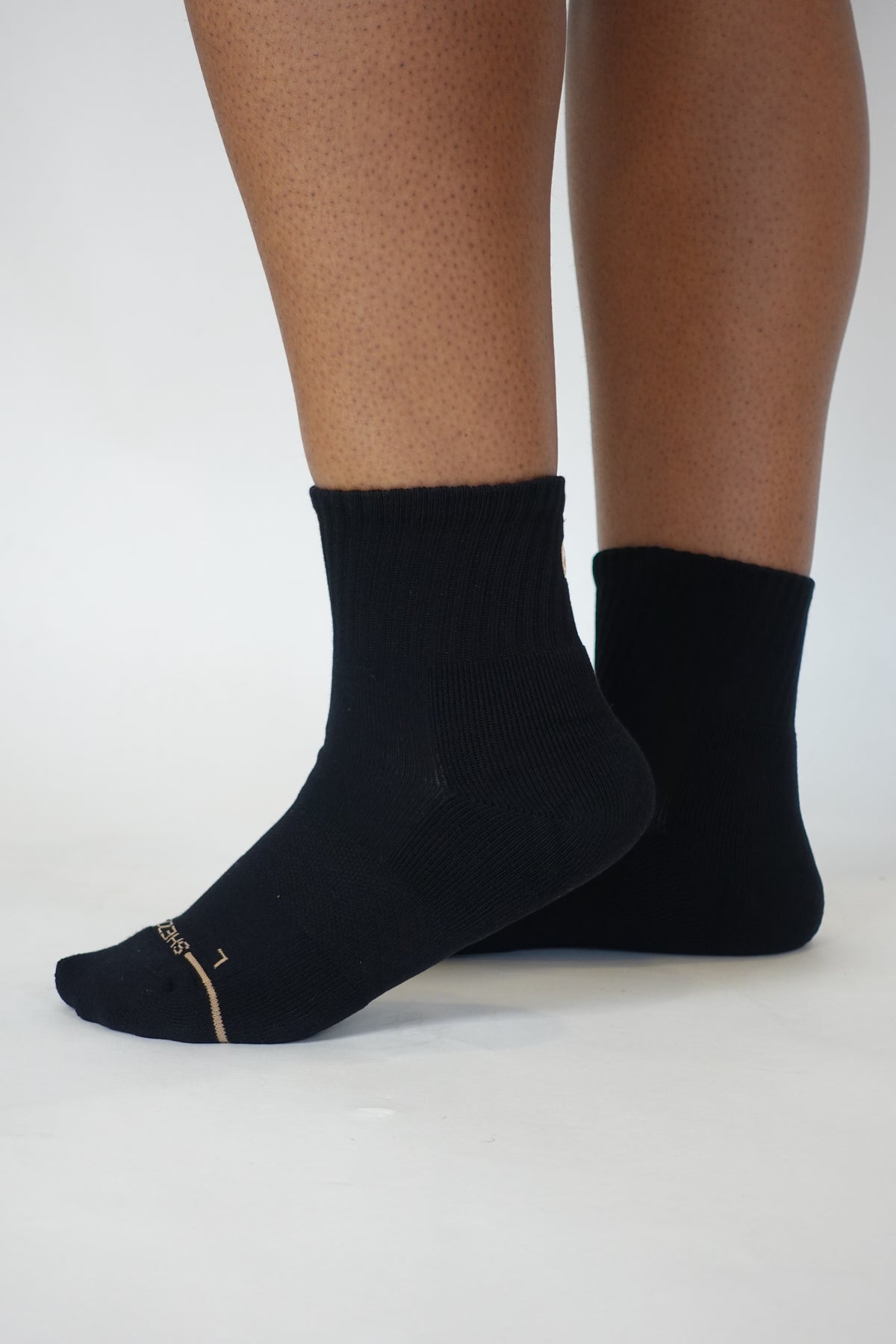 Black Shezza unpadded quarter socks worn on both feet