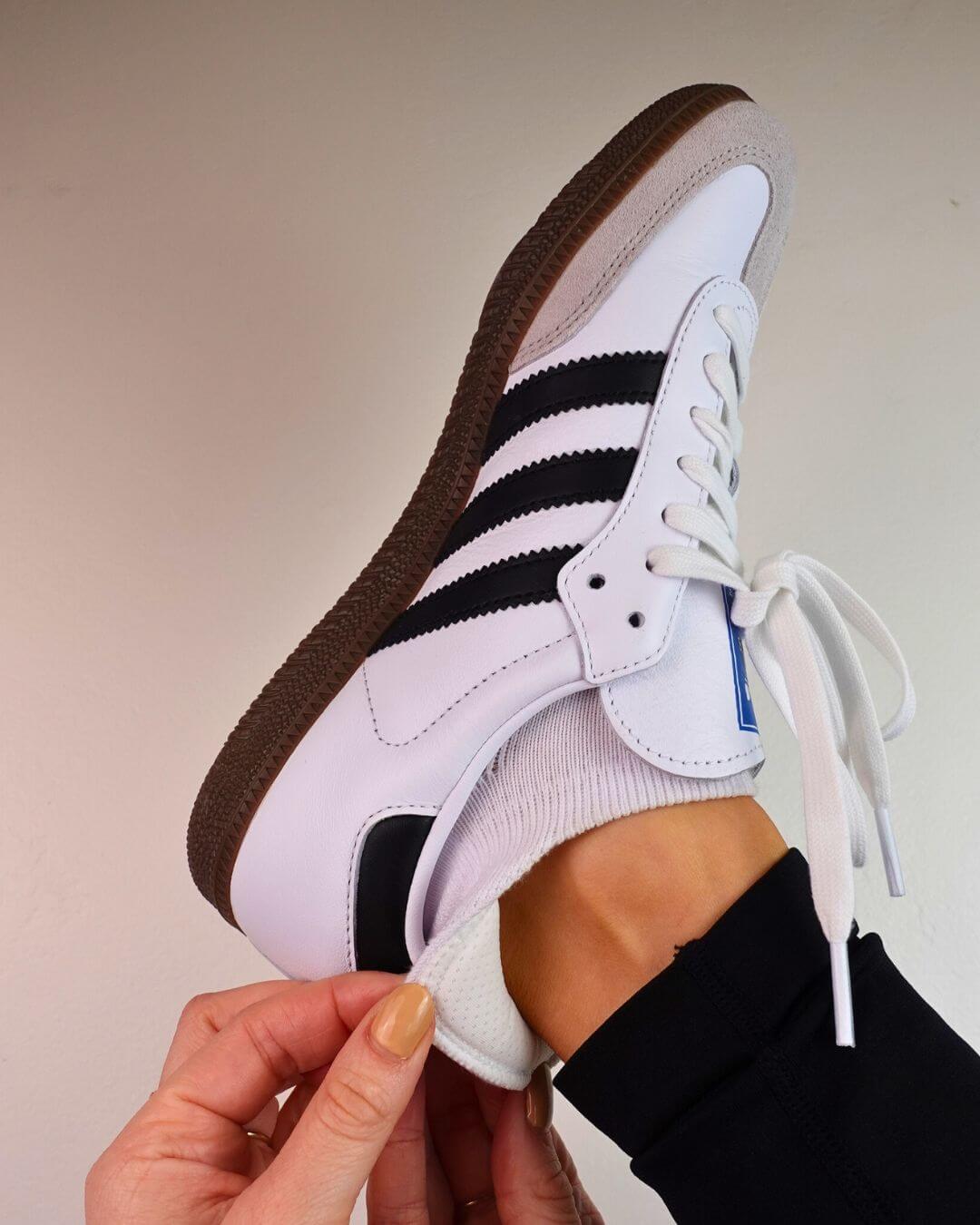 White padded ankle sock worn with a black and white Adidas Samba sneaker