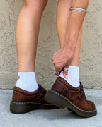 White padded quarter socks worn with brown loafers