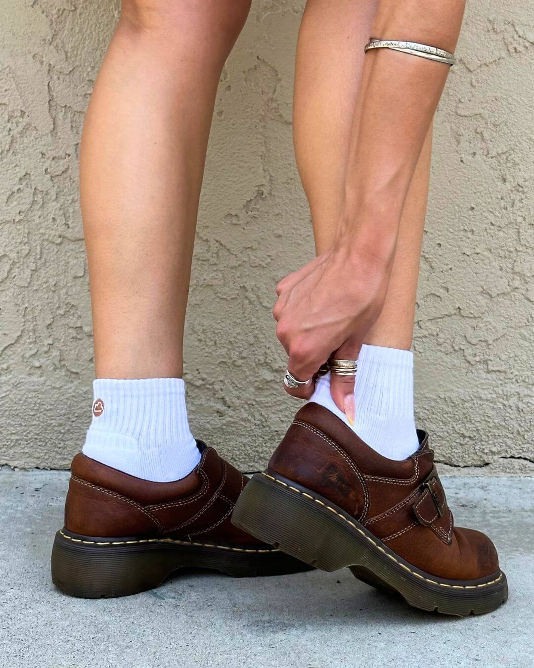 White padded quarter socks worn with brown loafers