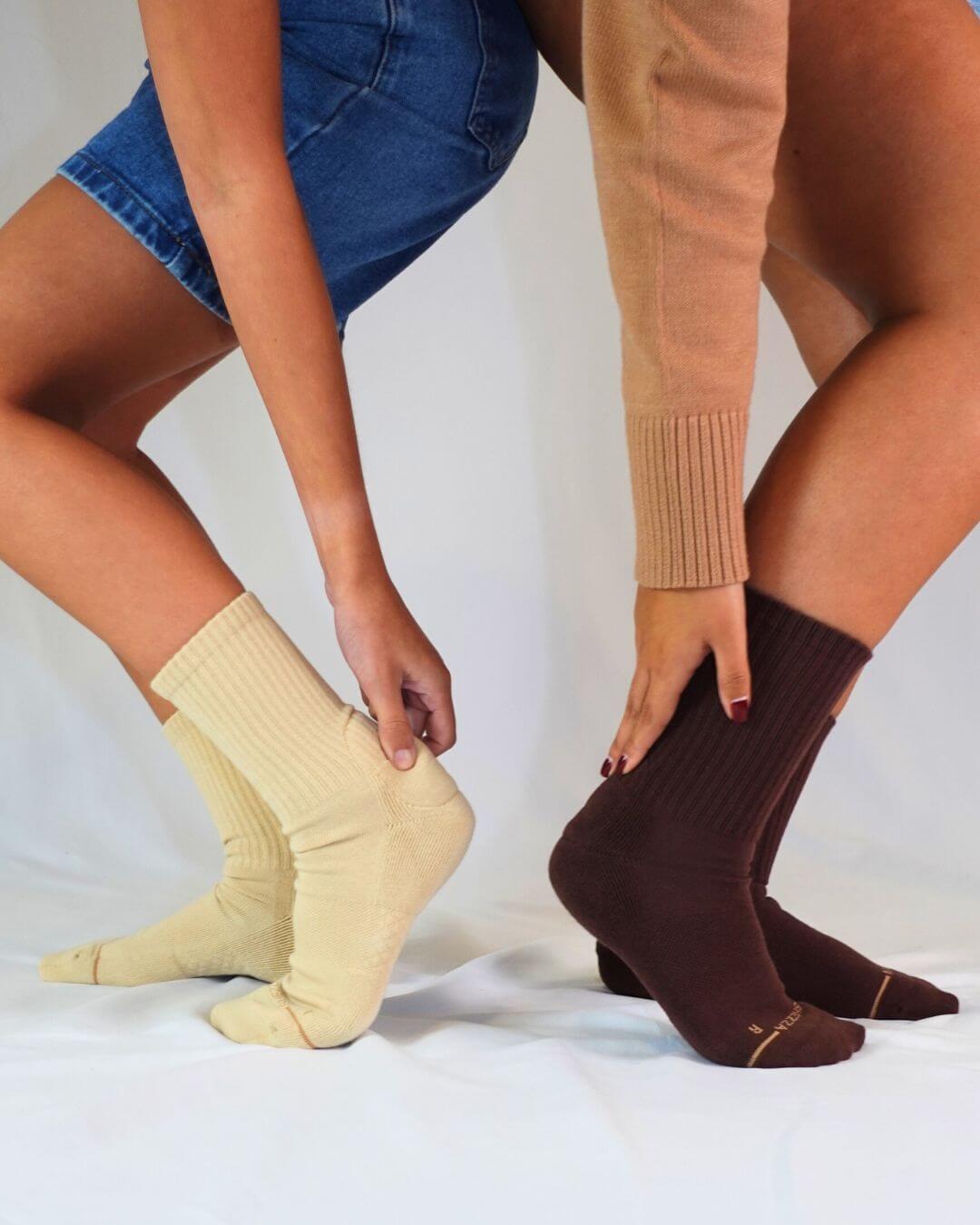 Two people wearing yellow and brown padded crew socks