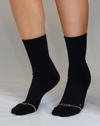 Black Shezza unpadded crew socks worn on both feet