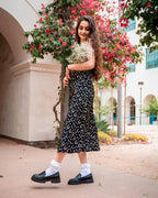 Woman wearing white padded lace socks with black loafers