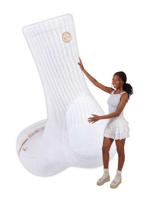 Woman holding a large white sock with a brand logo on a white background