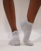 Grey Shezza padded ankle sock worn on a foot