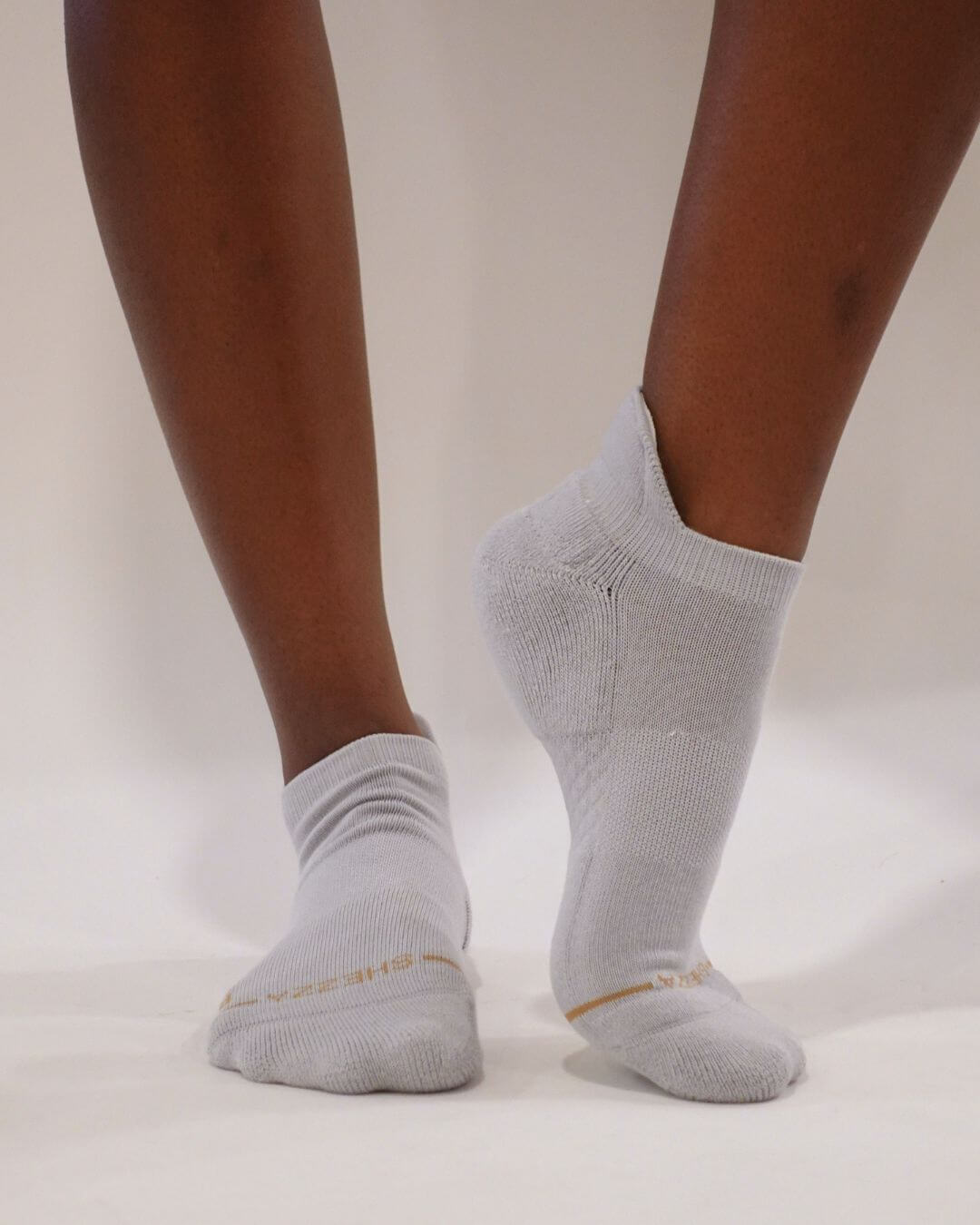 Grey Shezza padded ankle sock worn on a foot