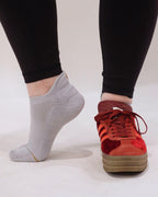 White padded ankle socks worn with dark red shoes