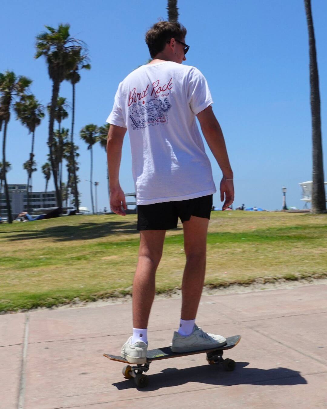 Person skateboarding outdoors wearing Shezza socks