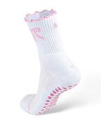 White Pilates grip sock with pink trim and pink grip dots on a mannequin foot