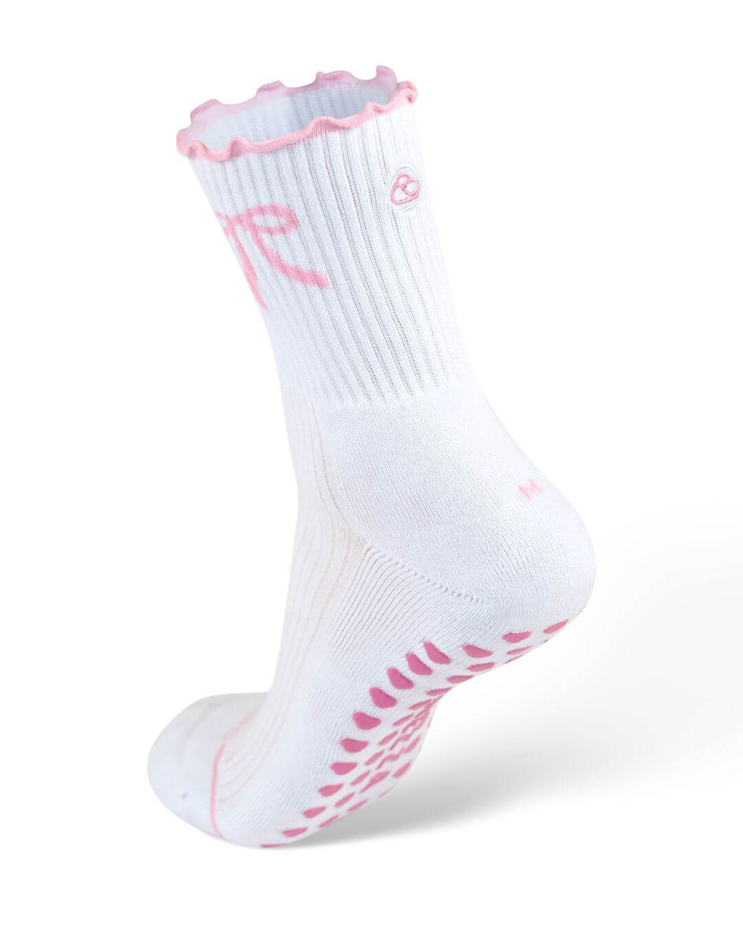 White Pilates grip sock with pink trim and pink grip dots on a mannequin foot