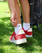 White padded quarter socks worn with red and white trainers