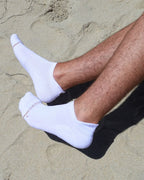 White Shezza unpadded socks worn on sand